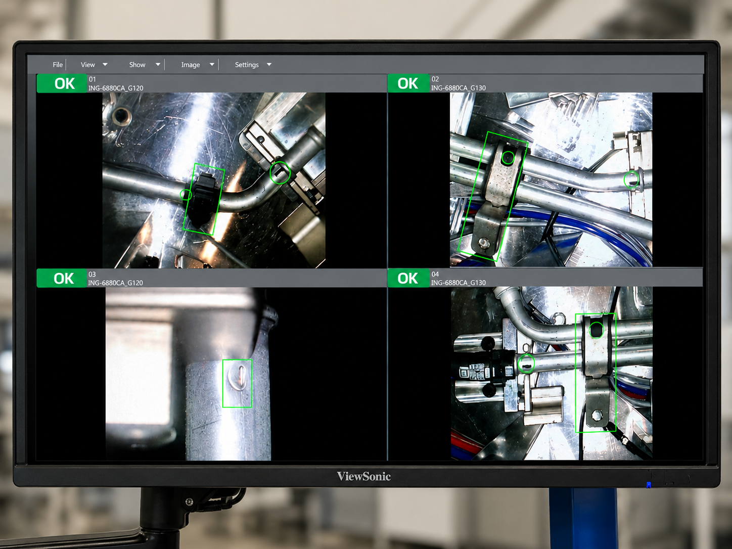 Quad-camera inspection monitor showing metal piping welds with green OK markers and highlighted bolts/contacts, indicating good status.